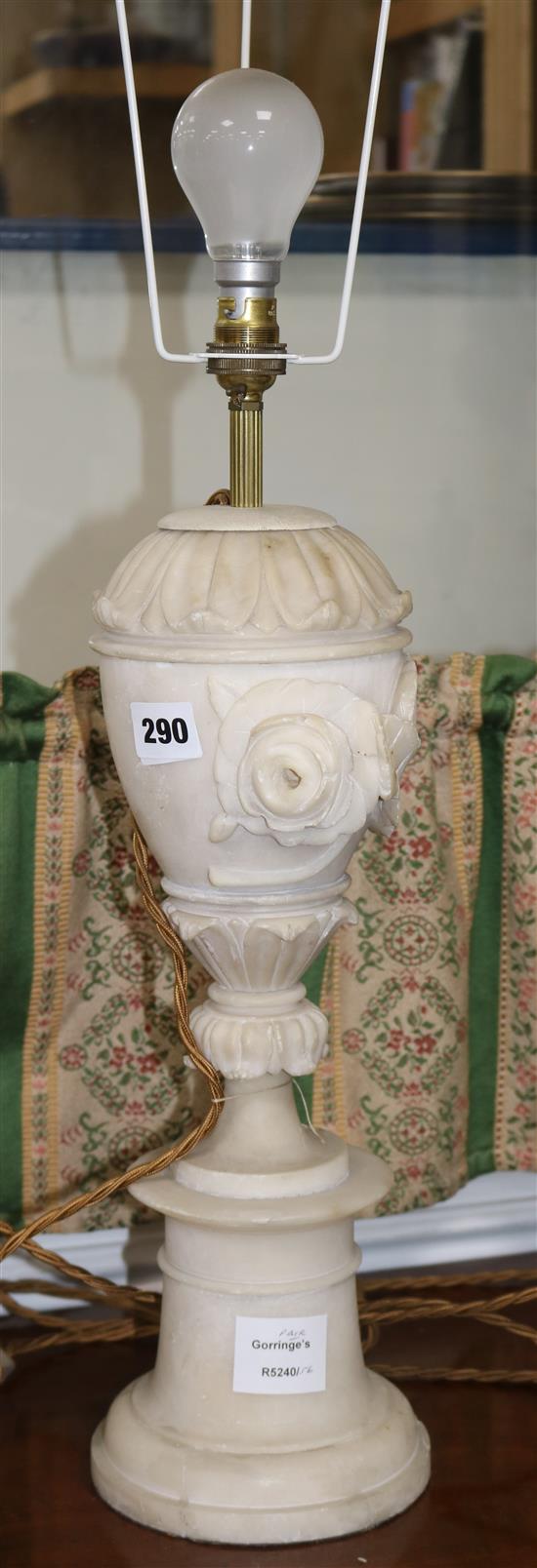 A pair of carved alabaster table lamps